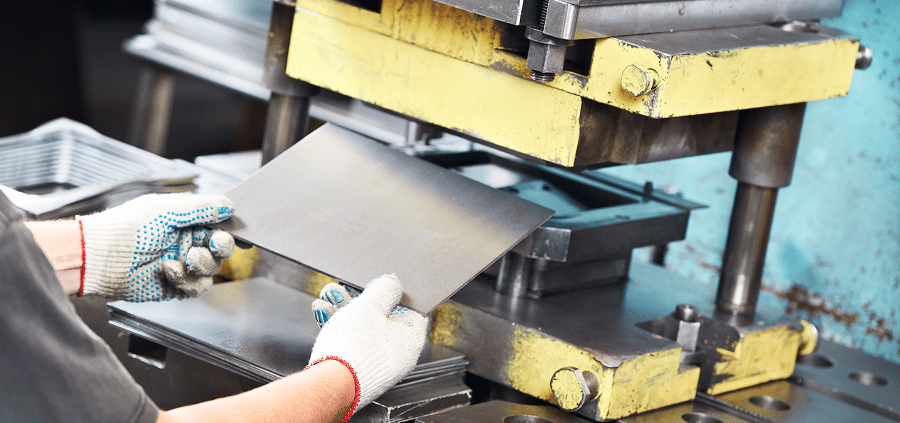 Industrial metal forming process in action.